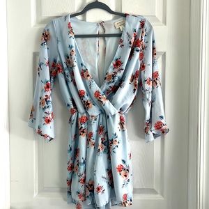 Womens blue floral romper size S stretchy waist low v neck front with open back